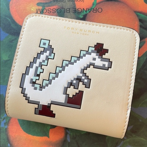 Tory Burch Tan Wallet with Pixel Dinosaur - Picture 1 of 3